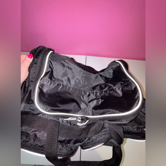 Black Duffel Bag with White Accents and Modern Design - Picture 10 of 13